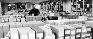 man among filing boxes