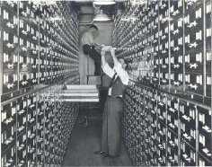 men among filing cabinets