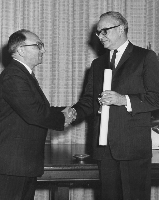 Ball shaking hands with Cohen