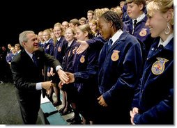 President George W. Bush greets members of the Pennsylvania FFA at their annual convention at Pennsylvania State University Tuesday, June 14, 2004. "I appreciate the fact that the Pennsylvania FFA has made a table for the Crawford, Texas FFA. I'm looking forward to telling the folks there at Crawford how decent the good folks here are in Pennsylvania, said President Bush." White House photo by Eric Draper