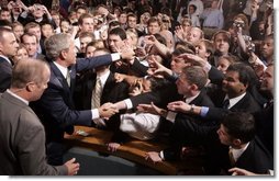 President George W. Bush reaches out to the crowd Thursday, June 23, 2005, after a Conversation on Strengthening Social Security at Montgomery Blair High School in Silver Spring, Maryland.  White House photo by Paul Morse