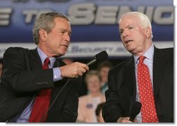 President George W. Bush shares the microphone with Senator John McCain, R-Ariz., as they speak to an audience at the Tucson Convention Center Monday, March 21, 2005, about strengthening Social Security. White House photo by Eric Draper 