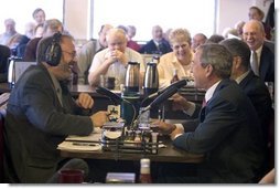 President George W. Bush and Sen. Chuck Grassley, R-Iowa, participate in an interview with radio talk show host Jan Mickelson at the Spring House Family Restaurant in Cedar Rapids, Iowa, March 30, 2005.White House photo by Paul Morse 