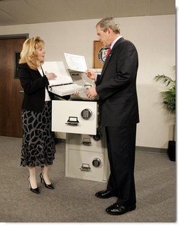 President George W. Bush tours the Treasury Agency's Bureau of Public Debt, with Director Susan Chapman, in Parkersburg, W.Va., Tuesday, April 5, 2005. White House photo by Paul Morse