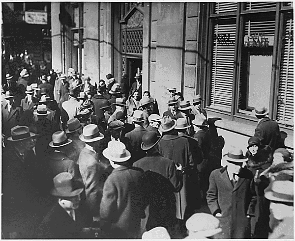 people milling around outside closed bank