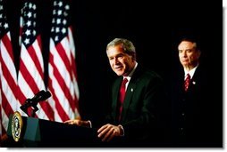 As Health and Human Services Secretary Tommy Thompson stands by, President George W. Bush discusses Medicare in the Dwight D. Eisenhower Executive Office Building Tuesday, Oct. 29, 2003. "The best way to provide our seniors with modern medicine, including prescription drug coverage and better preventative care, is to give them better choices under Medicare," said the President talking about pending Medicare legislation White House photo by Tina Hager