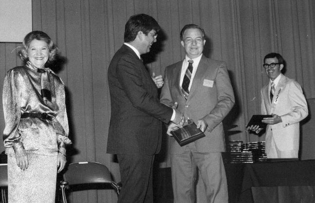 Simermeyer on stage receiving award