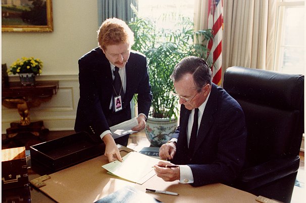 Photo of President Bush filing his own claim for Social Security and Medicare