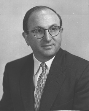 Wilbur Cohen in suit and glasses