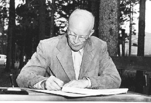 Ike signing bill outdoors