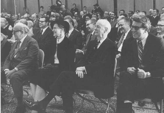 large group sitting on chairs