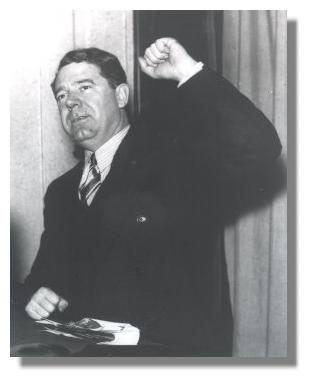 Huey Long with fist raised