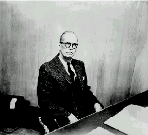 serious looking man at desk