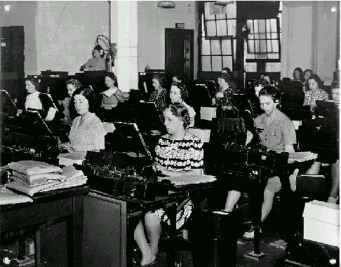 women typing on machines