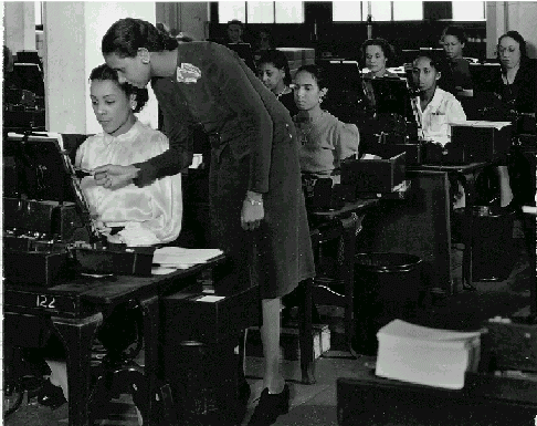 black women typing at machines