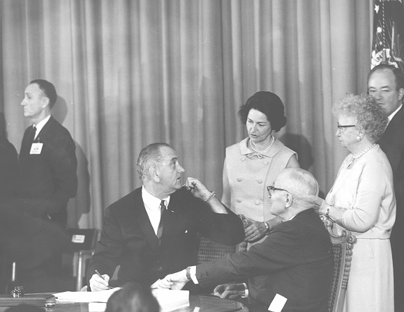 President Johnson talking to Lady Bird