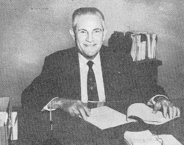 Milt Freedman at desk