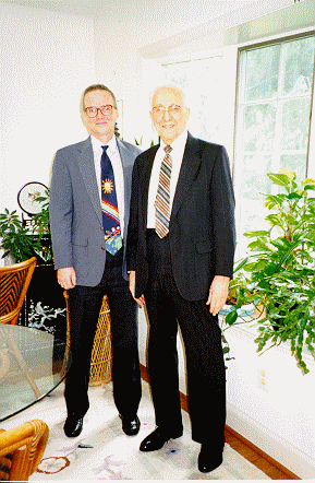 Myers and DeWitt standing in sunroom