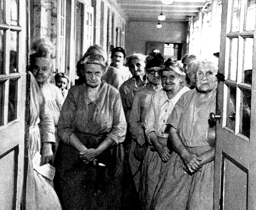 women in doorway of poorhouse