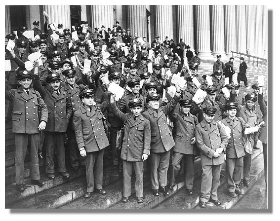 large group of postmen on steps