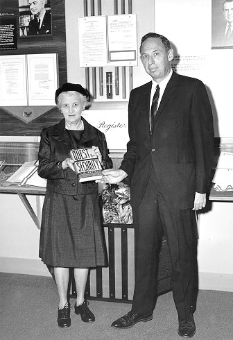 woman presenting book to Bortz