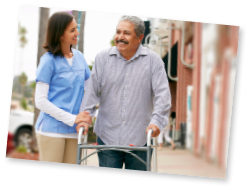 woman helping man using a walker