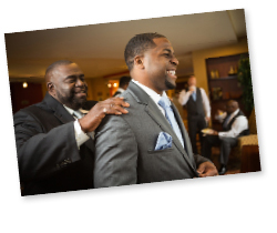 two men having fun at a wedding